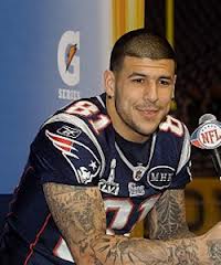 NFL Star Aaron Hernandez Put Into Cop Car Outside Home